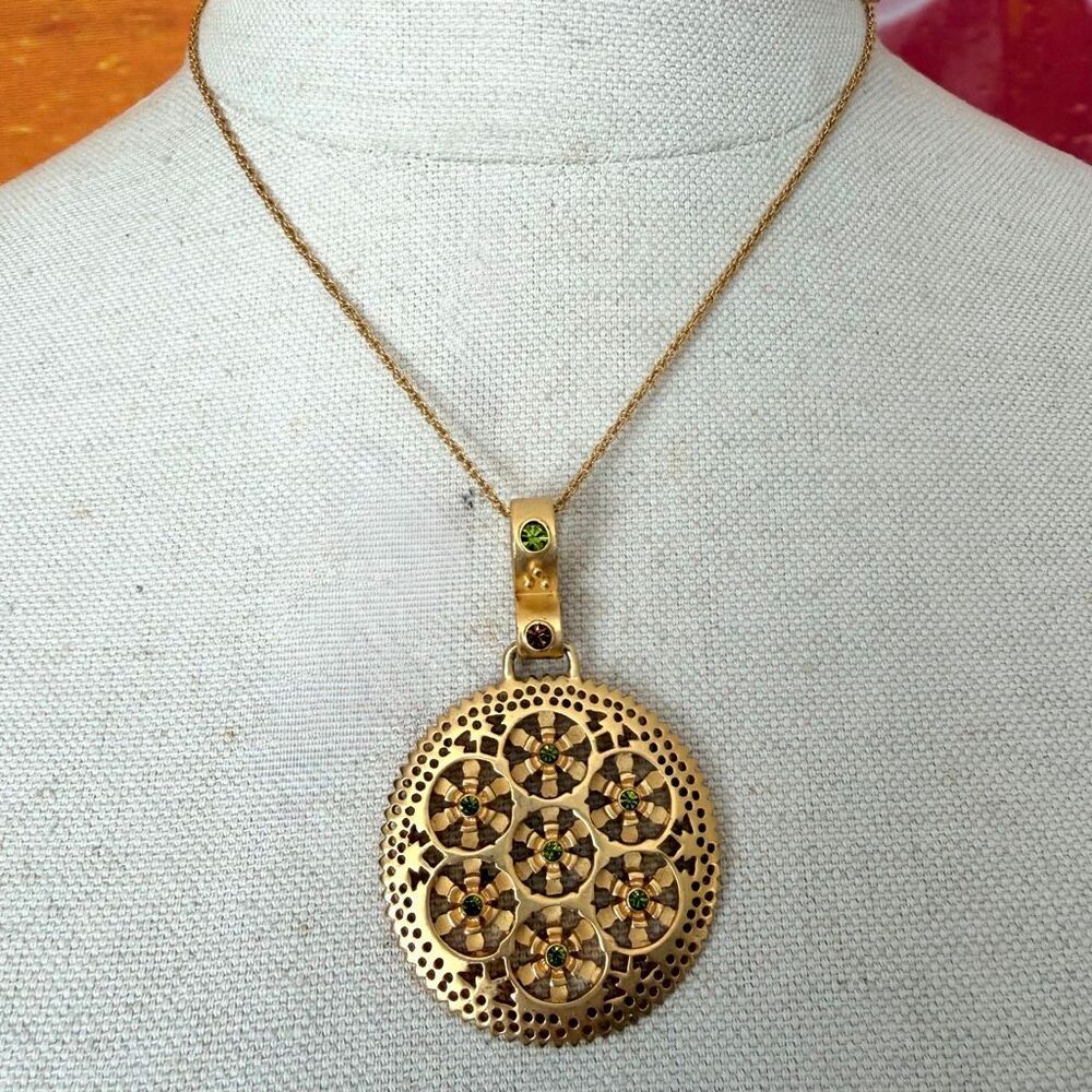 Vintage Gold Tone Pierced Medallion Pendant Necklace with Green Rhinestone Flowe
